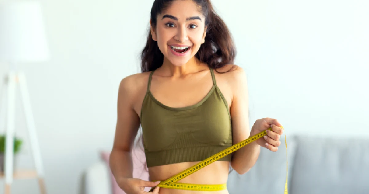 Smiling woman representing success in a medically assisted weight loss program in West Haven, UT