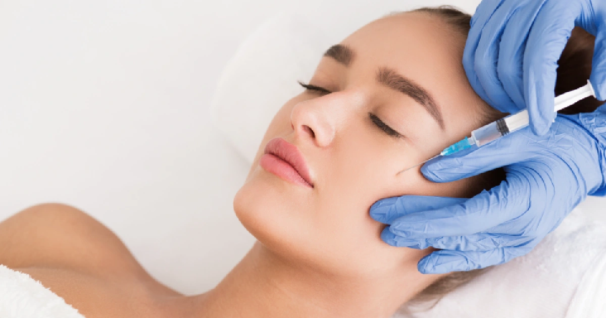 Professional Administering Sculptra Injection Into The Cheek by Mason Aesthetics & Wellness in West Haven UT